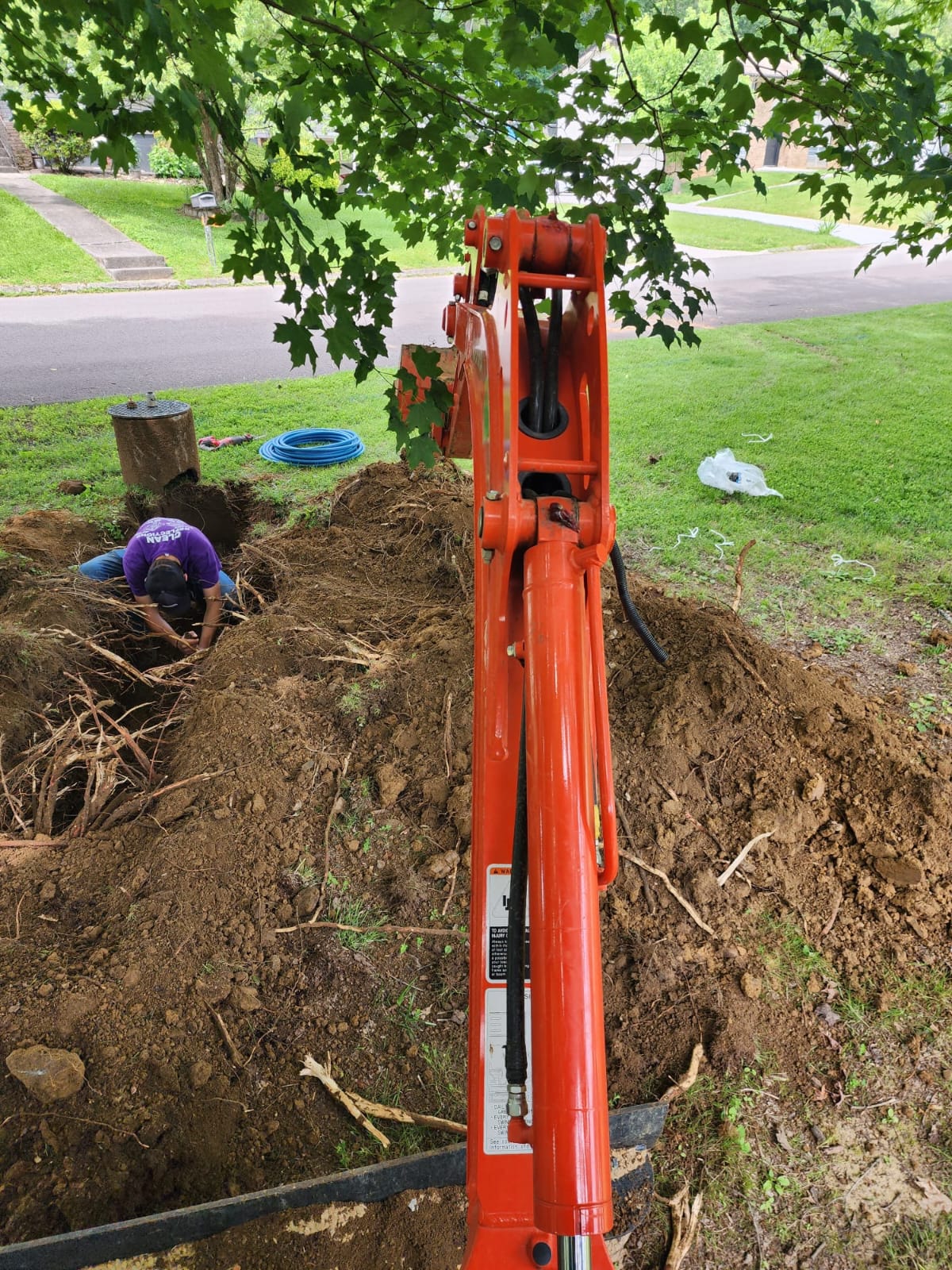 The Drain Man working on an underground draining system